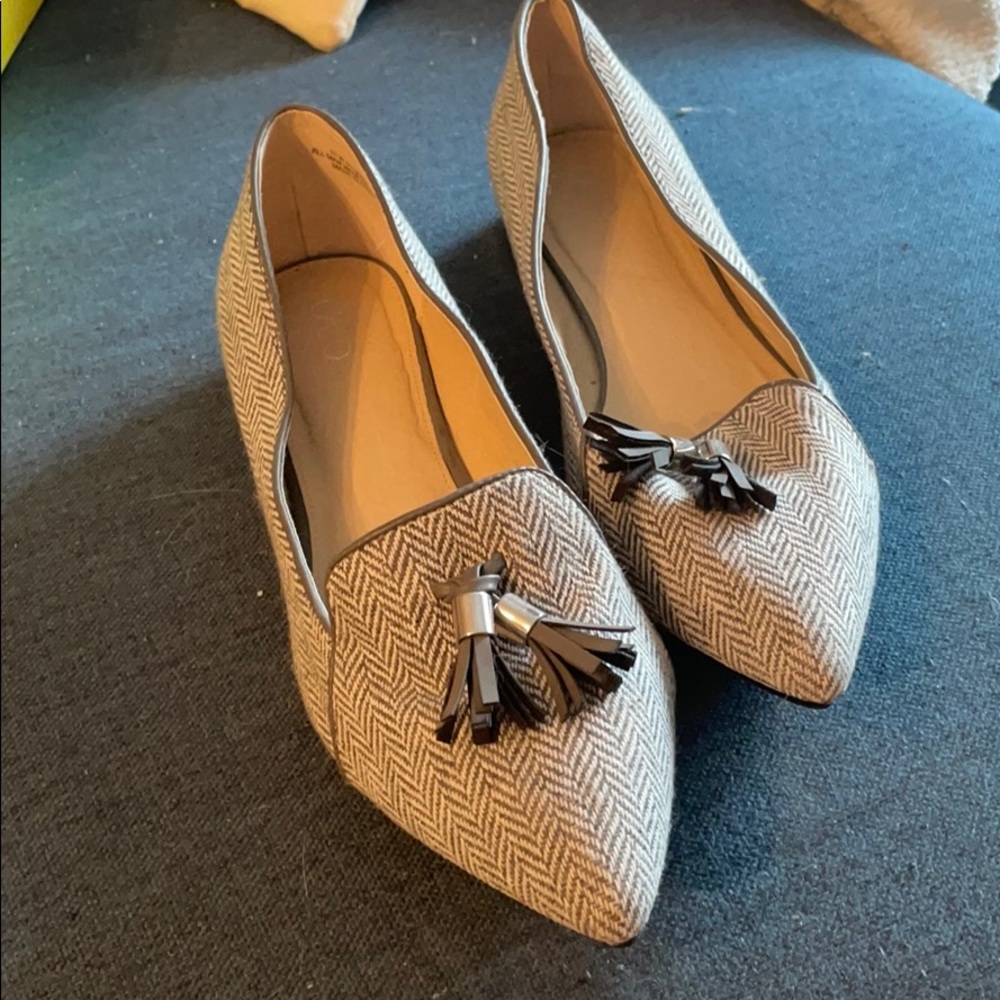 Pointed toe flats with tassels